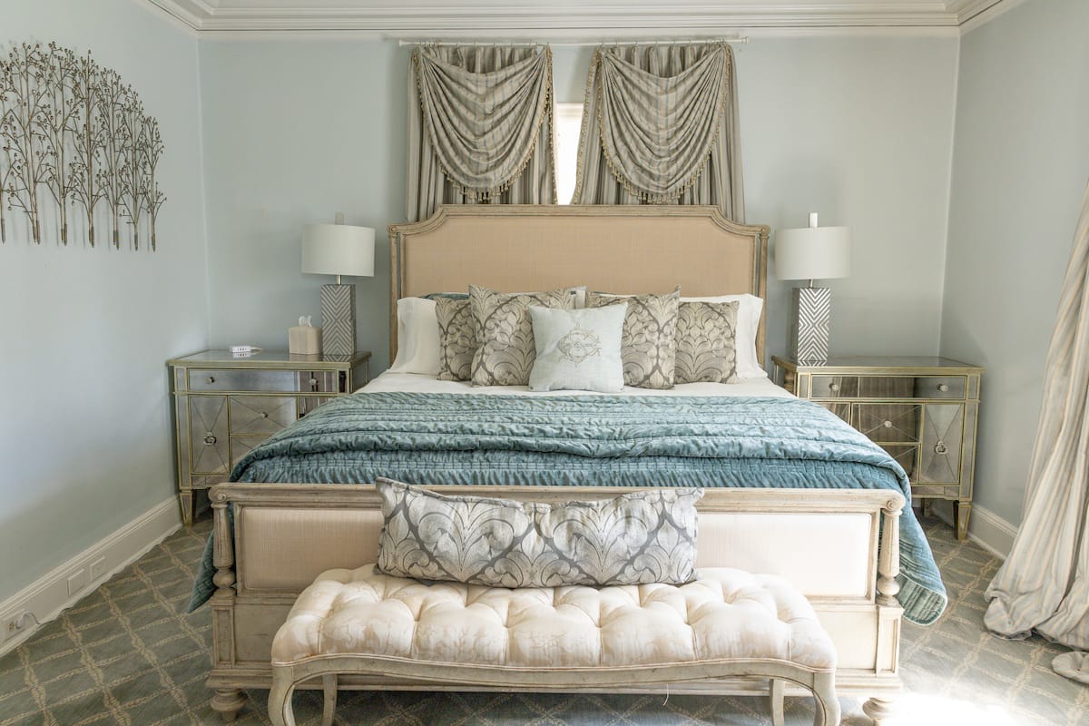Blue and silver king bedroom with mirrored nightstands
