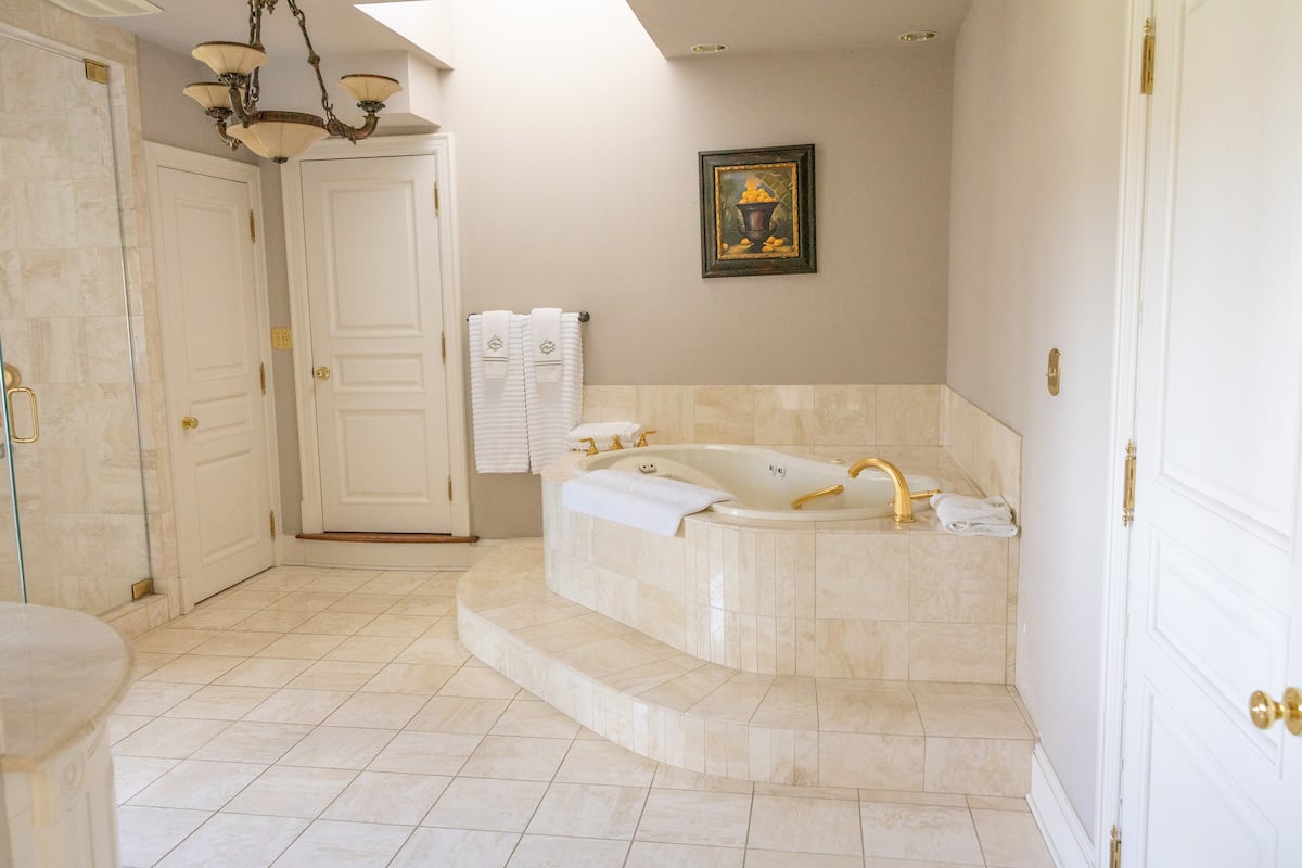Master bathroom with marble glass shower and jacuzzi tub