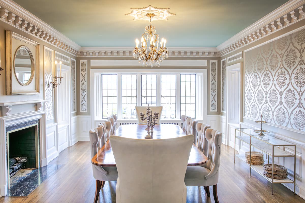 Formal dining room with chandelier and fireplace